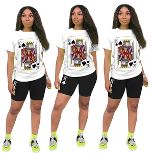 Detailed close-up of King of Spades poker print on white t-shirt and biker shorts set