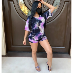 Women tie-dye two-piece loungewear set featuring V-neck batwing top and matching shorts