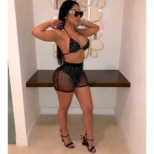 Detailed side view of black two-piece bikini set with silver rhinestones and mesh shorts