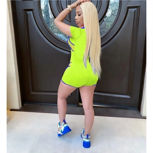 Detail of neon green romper with blue trim showing the back fit and high-stretch fabric