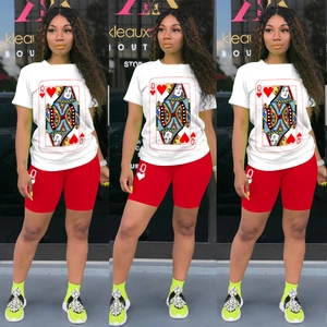 Detail of Queen of Hearts graphic print on white T-shirt and red cycling shorts