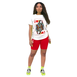 Detail of two-piece set featuring a white Queen of Hearts T-shirt and red biker shorts