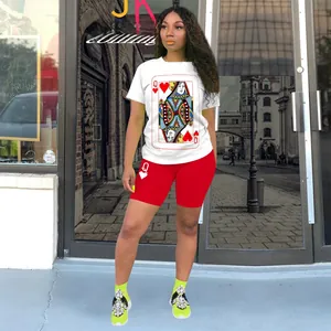 Close-up of Queen of Hearts poker print on white T-shirt and red cycling shorts set