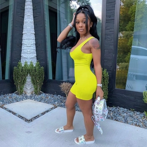 Detail of yellow sleeveless bodycon romper with a U-neck design and high-stretch fabric