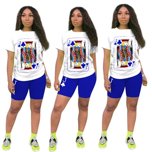 Women's two-piece outfit featuring white playing card print t-shirt and blue biker shorts