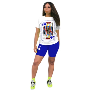 Detail of playing card Jack of Clubs print on white t-shirt and blue cycling shorts set