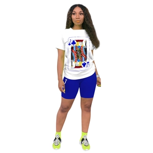 Detail shot of white t-shirt and blue cycling shorts with playing card Jack print