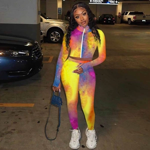 Detail of colorful tie-dye tracksuit featuring a zip-up top and high-waisted leggings