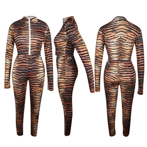 Detail of tiger print two-piece sports set with front zipper and high waist leggings
