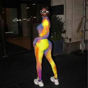 Detailed view of colorful tie-dye print tracksuit with cropped top and high waist leggings