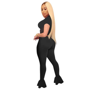 Back view of black two-piece set featuring crop top and flared pants with ruffled hem