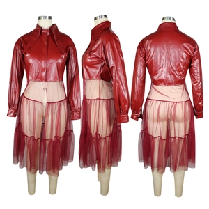 Detail view of dark red PU leather and mesh stitching on the long sleeve dress