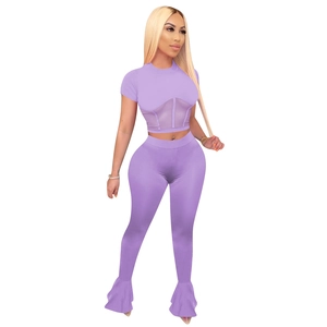 Detail of lavender mesh patchwork crop top and flared leggings two-piece yoga set