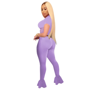 Detail view of the lavender purple two-piece set featuring mesh flare pants and crop top