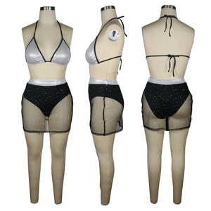 Detailed view of women's silver halter bra and black sequin mesh skirt set from three angles