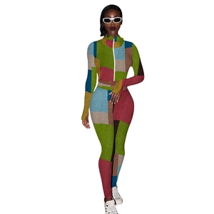 Detail of colorful patchwork print on long-sleeved zipper top and slim pants set
