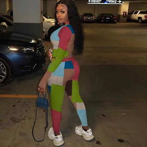 Close-up of multi-color block print long sleeve bodysuit with slim fit athletic cut