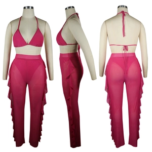 Detailed views of hot pink mesh cover-up pants set with a halter bikini top and ruffles