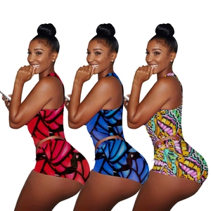 Detailed comparison of three butterfly print yoga sets in red, blue, and multicolor