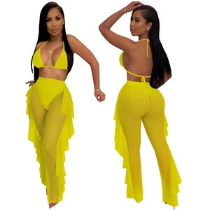 Three-piece neon yellow beach set with tie bikini and ruffle mesh pants on white background