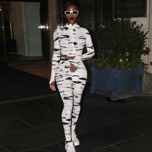 Detail of marble print tracksuit featuring sleeve thumb holes and high waist leggings