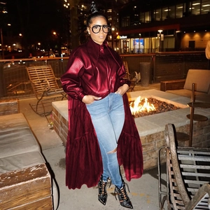 Deep burgundy high-shine longline PU leather shirt jacket with ruffled hem and balloon sleeves