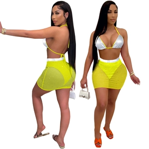 Two-piece summer set with silver halter bikini top and yellow sequin mesh skirt