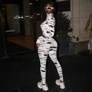 Detail of zebra print two-piece slim fit set with cropped top and leggings for women