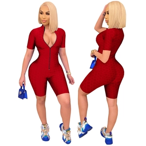 Women's red short sleeve jumpsuit with waffle texture and front zipper closure