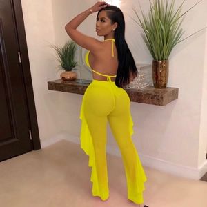 Detail of neon yellow mesh set showing the halter neck tie and side ruffle pants