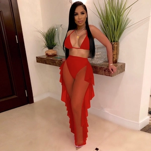 Detailed view of red three-piece swimwear featuring ruffle mesh trousers and bikini set