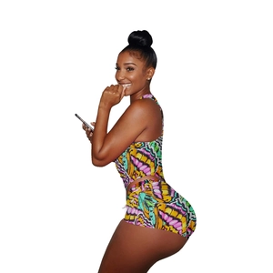 Close-up of slim-fit two-piece set with vibrant butterfly wing print and high-waist shorts