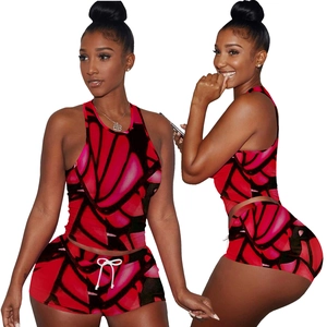 Two-piece women's athletic set with vibrant red and black butterfly print textures