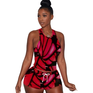 Detail of red and black butterfly print sleeveless sports crop top and drawstring shorts