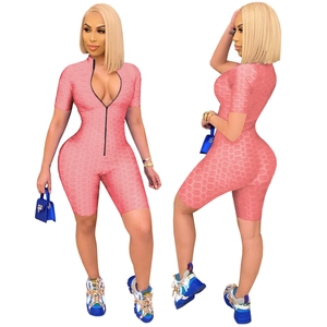 Pink textured ribbed yoga romper with long front zipper and short sleeves for workout