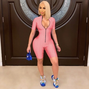 Pink high-stretch textured romper with front zipper and short sleeves for sports or clubs