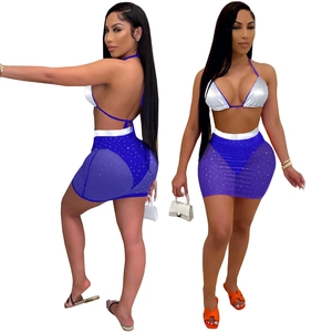 Two-piece set with silver halter bikini top and blue mesh sequin skirt for beach party