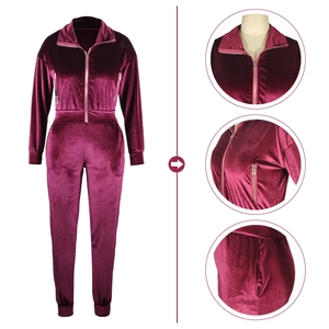 Women's burgundy velvet tracksuit featuring a high neck zipper top and matching jogger pants