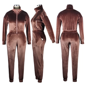 Three-way view of velvet long-sleeve jumpsuit with front zipper and functional pockets