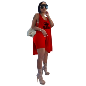 Detailed view of the red two-piece set featuring a QUEEN sleeveless top and cycling shorts