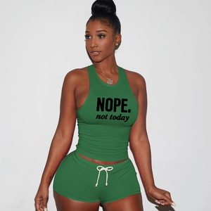 Detail of green women's two-piece set with NOPE. not today print and drawstring shorts