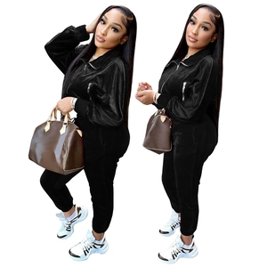 Women's 2-piece velvet tracksuit featuring a zipper jacket and matching joggers in black