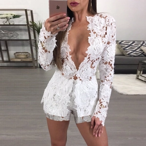 Detailed view of intricate white floral lace texture on long sleeve top and shorts set