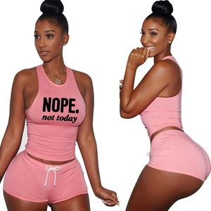 Women's pink two-piece set featuring NOPE print tank top and drawstring shorts