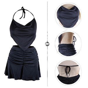 Detail view of black two-piece set featuring cowl neck top and side drawstring ruched skirt