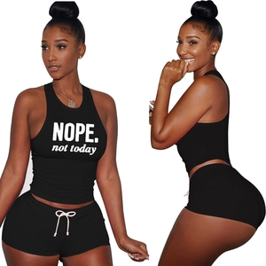 Close-up of cotton sports set with nope print crop top and high-waist drawstring shorts