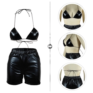 Detailed views of shiny black PU leather bikini set with halter top and high-waisted shorts