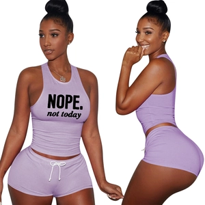 Detail of lavender two-piece workout set with NOPE printed top and drawstring shorts