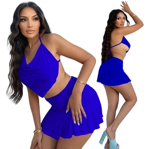 Royal blue two-piece set featuring halter cowl neck top and matching ruched mini skirt