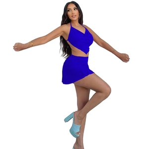 Detail of royal blue halter crop top and ruched mini skirt set in stretchy fabric